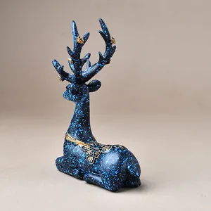 Blue resin elk figurine with gold floral patterns and artistic long antlers home decor