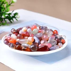 Polished natural colorful agate stones in a ceramic tray for home decor and aquarium