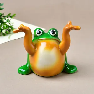 Funny green frog figurine pen holder desk ornament with a glossy resin finish