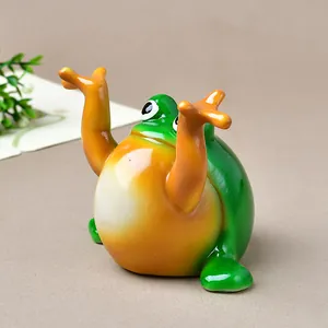 Cute green cartoon frog resin desktop ornament with orange belly and expressive big eyes