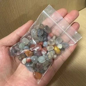 Close-up of mixed natural agate and salt source crystal raw stones held in hand