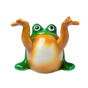 Whimsical green frog statue pen holder with raised hands for home desk decoration