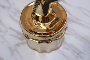 Golden ceramic unicorn jewelry box with lid featuring a polished horse head sculpture