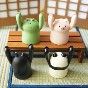 Kawaii animal card holders including pink pig and black cat for desk organization