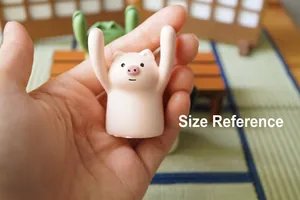 Miniature pink pig figurine size reference held in hand for desktop decoration