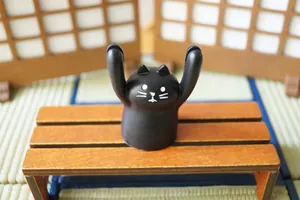 Cute black cat resin figurine holding hands up for desk decor and pen holder