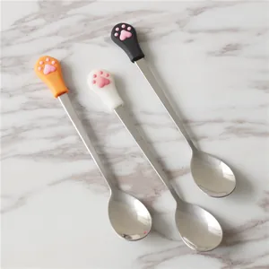 Detail of cute cat paw spoons with pink 3D silicone pads and stainless steel handles