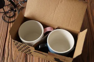 Ceramic cat mugs set in branded gift box with protective dividers on wood background