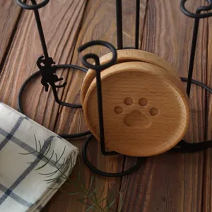Cat paw engraved wooden coasters with a minimalist black metal cat-shaped storage rack