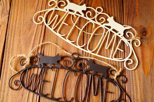 Vintage iron welcome sign with cat silhouettes and hanging jute rope for home decor