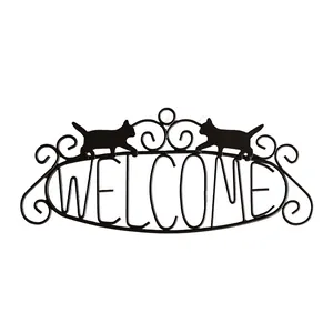 Vintage black iron cat welcome sign featuring silhouette kittens and metal scrollwork