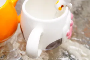 Cat paw ceramic coffee mug with 3D pink toe beans and cute kitten element on the rim