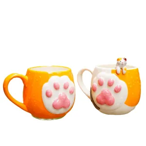 Ceramic cat paw mug set featuring 3D pink toe beans and a cute calico cat figurine