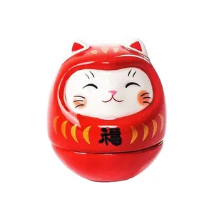 Japanese Daruma lucky cat ceramic ornament with fortune character on red tumbler body