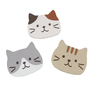 Three cute cartoon cat silicone coasters including calico and tabby patterns for heat insulation