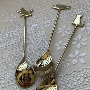 Three-piece gold stainless steel cat and fish coffee spoons with mirror-polished finish