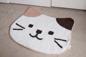 Close-up of a cute calico cat-shaped plush rug with soft microfiber texture and non-slip backing