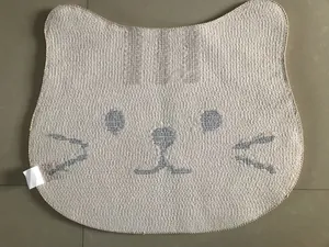 Close-up of cute calico cat-shaped woven rug with anti-slip backing and fine edge stitching