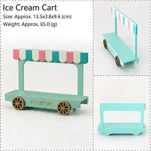Miniature mint green wooden ice cream truck model with striped awning for decor