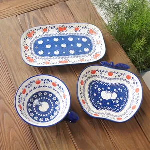 Japanese retro ceramic apple tableware set including plates and bowl on wooden table