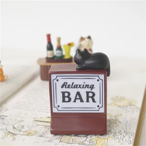 Miniature black cat figurine on Relaxing BAR resin stand for desk decor display