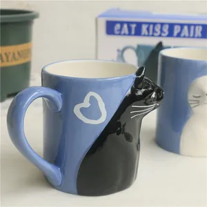 Japanese ceramic couple mugs set featuring kissing black and white cats with relief design