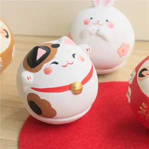 Hand-painted Japanese Maneki Neko ceramic tumbler ornament with cute zodiac rabbit and daruma