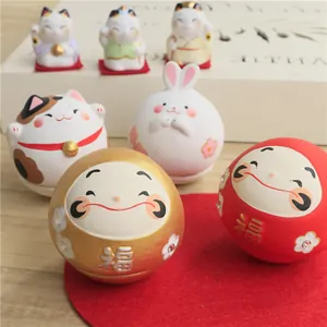 Hand-painted Japanese Daruma and Maneki-neko clay tumbler figurines for home decor