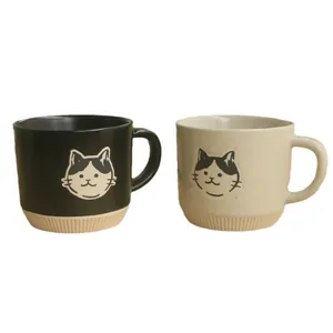 Japanese style black and beige ceramic cat mugs with matte finish and embossed cute faces