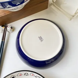 Detail shot of the ceramic plate bottom featuring Shina Casa logo in Japanese style