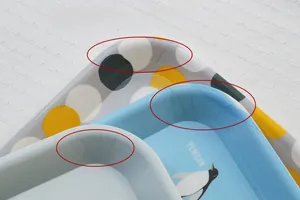 Detail shot of stackable cute penguin pattern melamine serving trays for fruits and candy