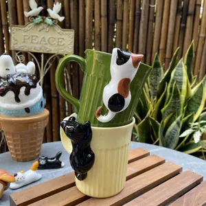 Cute ceramic cat mug with 3D embossed kitten and textured vertical stripes on wood table