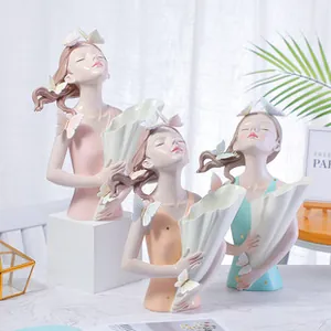 Artistic girl bust sculpture with butterfly detail and storage function in pastel colors