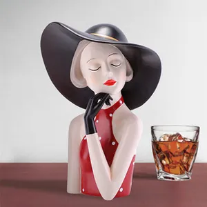 Artistic resin lady figurine with wide black hat and red polka dot dress for home decor