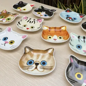 Set of 2 cute cat shaped ceramic dipping sauce dishes with varied feline patterns