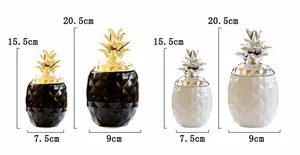 Comparaison de taille des pots ananas en céramique noir doré et blanc argenté
