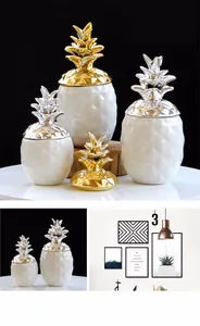 Détail des bocaux ananas en céramique avec couvercles métalliques dorés et argentés