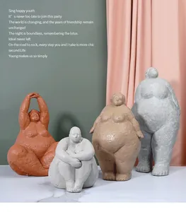 Detailed view of four artistic resin yoga lady sculptures with matte stone texture