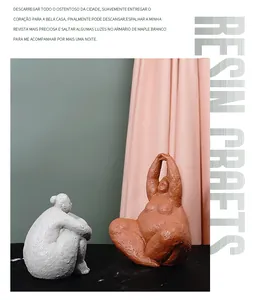 Artistic resin yoga figurines in grey and reddish brown with a matte grainy texture