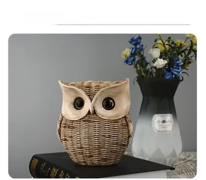 Detail of owl resin ornament featuring intricate woven texture and vintage ivory finish
