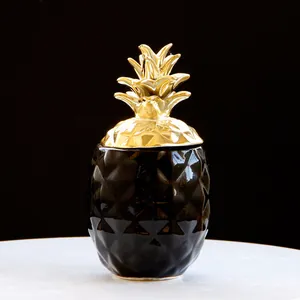 Pot de rangement ananas en céramique noire avec surface texturée et couvercle doré
