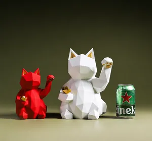 Size comparison of geometric lucky cat resin ornaments next to a 330ml soda can