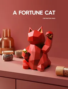 Macro detail of geometric resin fortune cat with metallic gold accents and red faceted finish