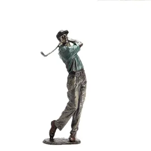 Modern bronze golf player statue in swinging pose on round base for home decor