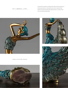 Close-up of golden peacock dancer sculpture showing intricate blue feather textures