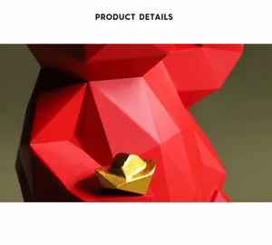 Macro detail of geometric red lucky cat resin ornament with a gold ingot accent