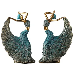 Elegant pair of resin peacock dancer figurines in bronze gold and turquoise finish