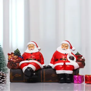 Set of two decorative Santa Claus resin figurines for Christmas tabletop home decor