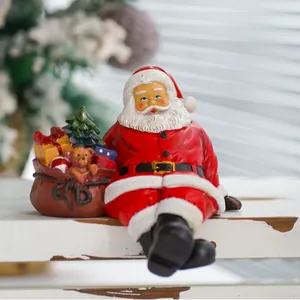 Sitting Santa Claus resin figurine with gift bag and bear for Christmas table decor