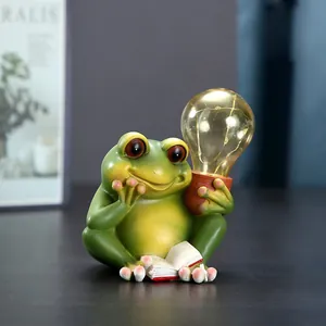 Figura de rana solar de resina leyendo con bombilla LED para decoración de jardín y exterior